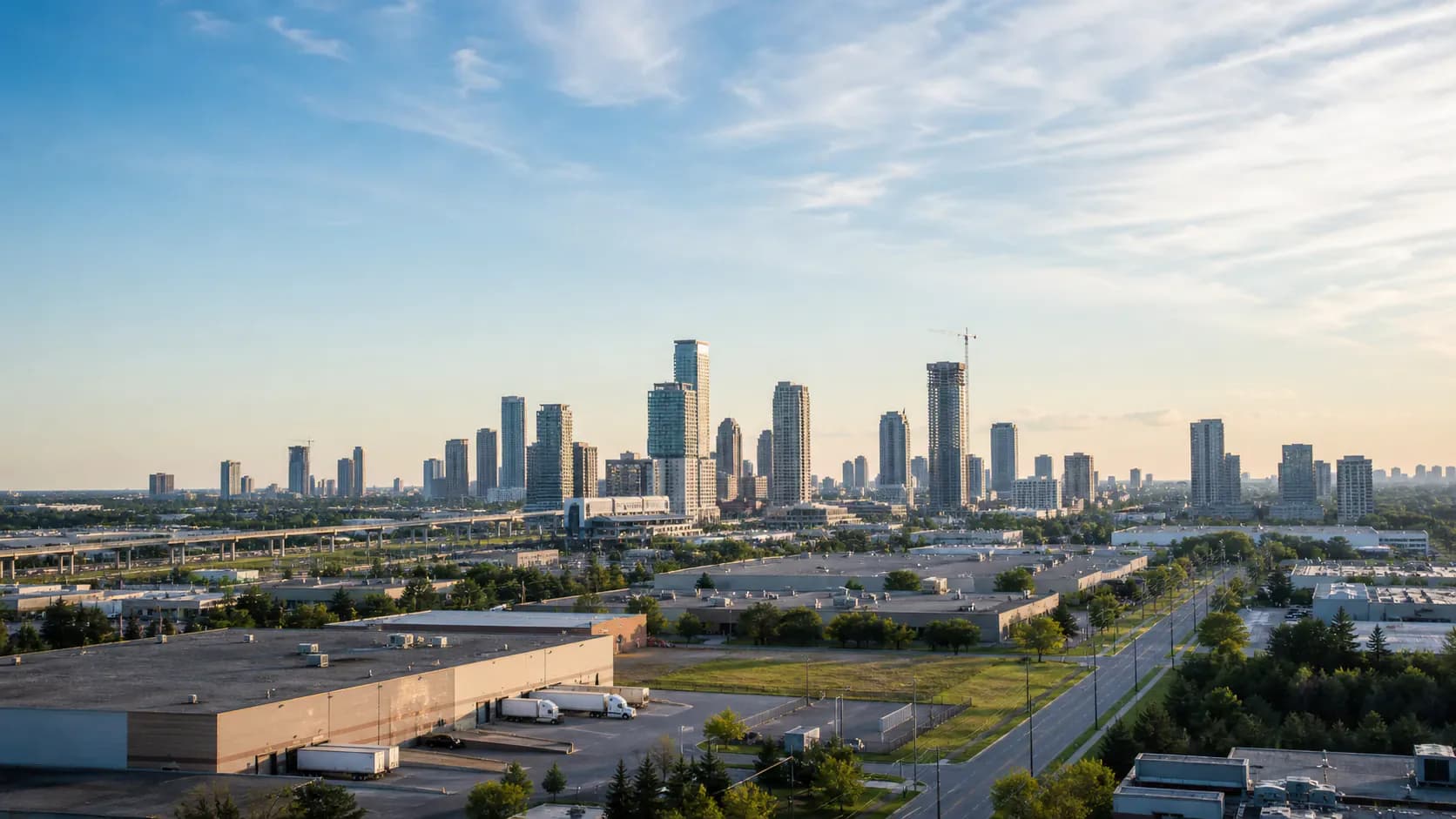 Editorial landscape representing Vaughan, Ontario with modern towers, warehousing, roads, and industrial buildings
